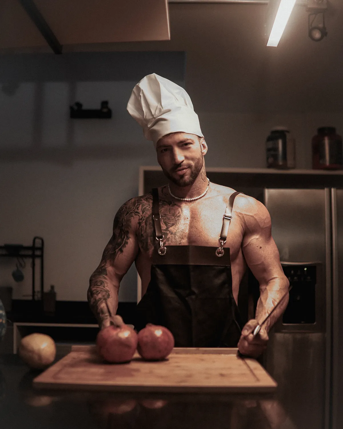 Maximo Garcia in a chef's apron preparing fresh food in a kitchen